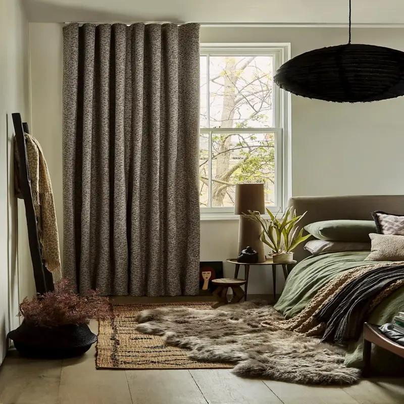 Thick textured curtain in earthy bedroom setting